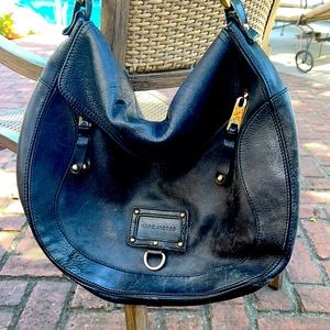 Marc Jacob’s large, black leather hobo. Loads of zippered pockets and pristine.